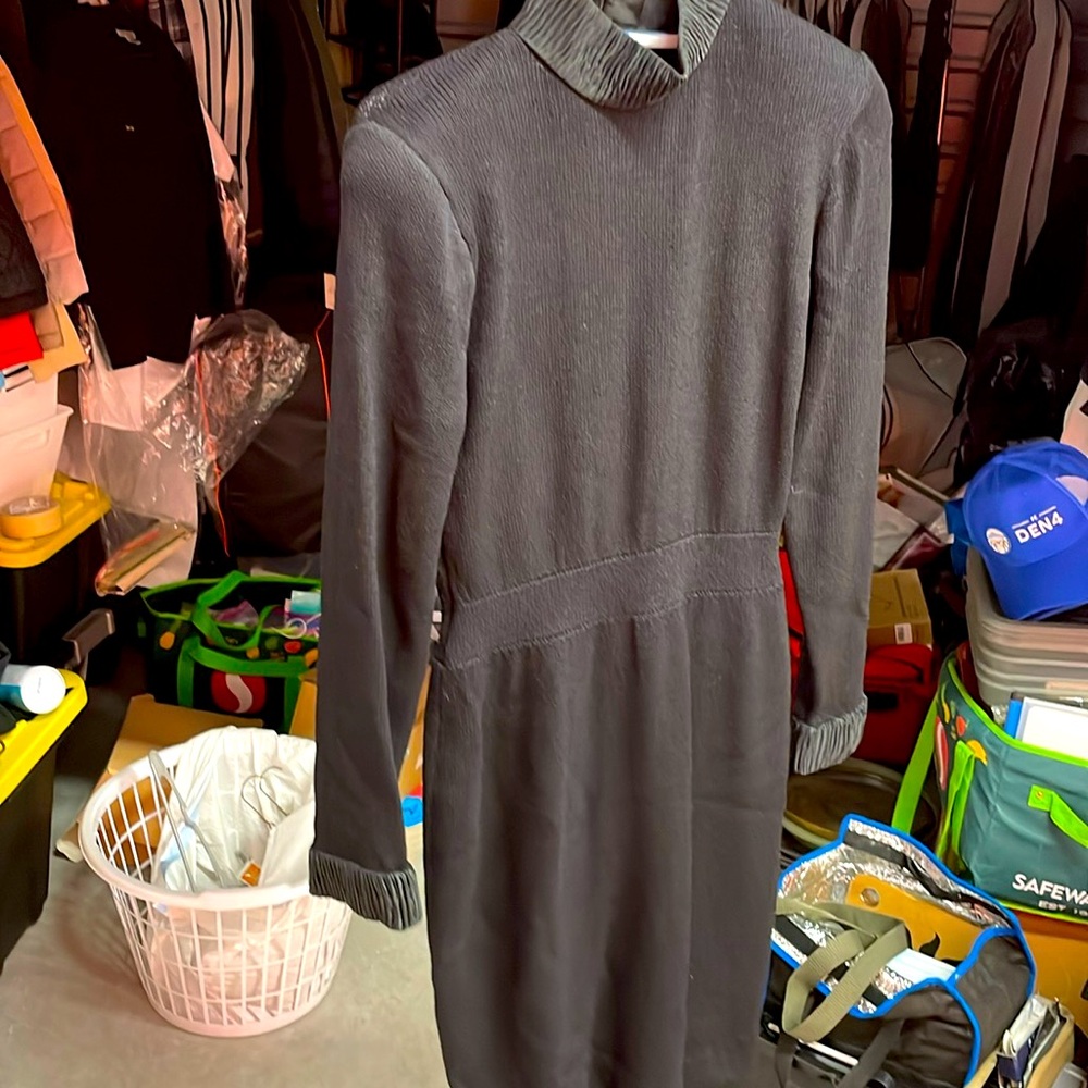 A black net dress with satin trim and an open back is very elegant.